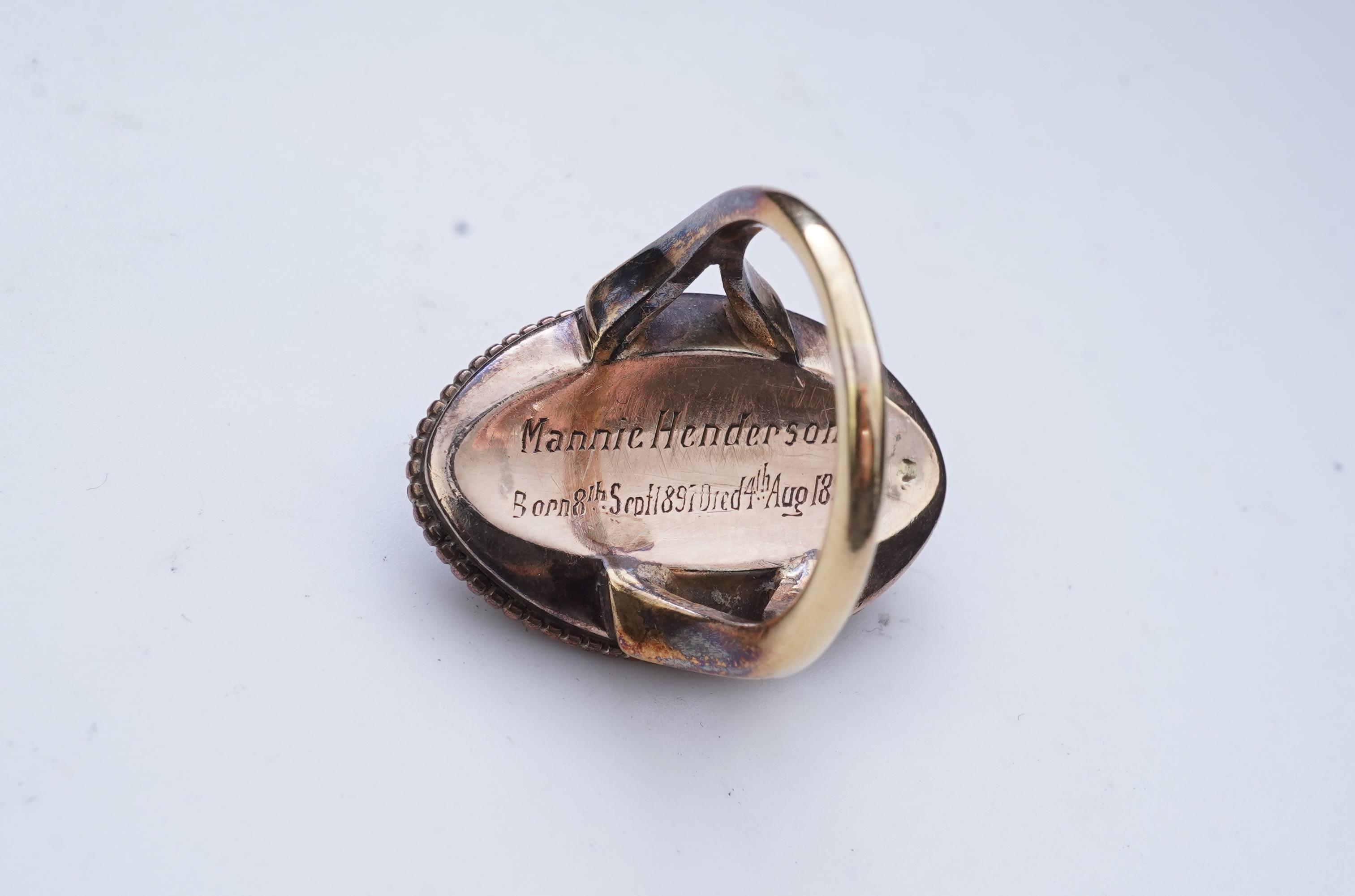 An enamel and diamond mourning ring, late 19th century